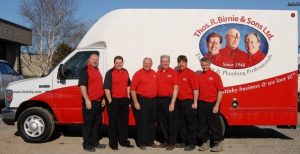 The 5Stinky team in front of the van with corporate vinyl graphics with the Thos R Birnie branding